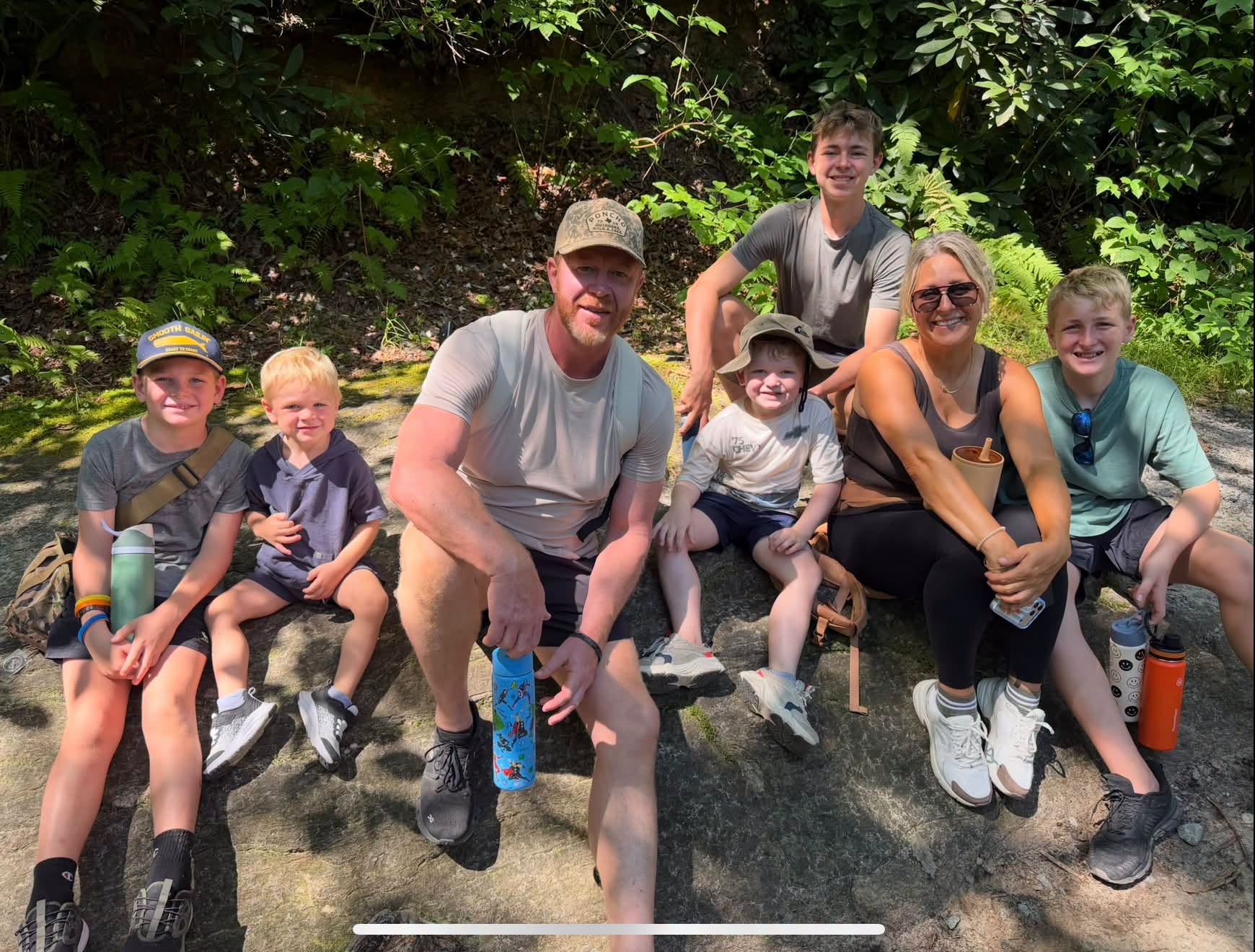 Michael Lush with his wife and five sons outdoors